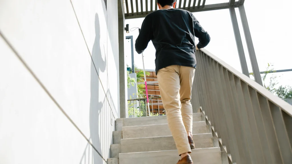 Man sitting on stairs contemplating how to stop procrastinating