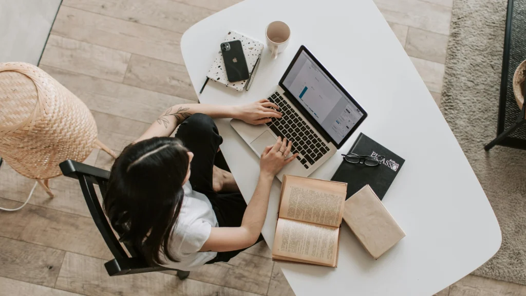 Young lady focusing on laptop, learning how to improve concentration and focus while studying