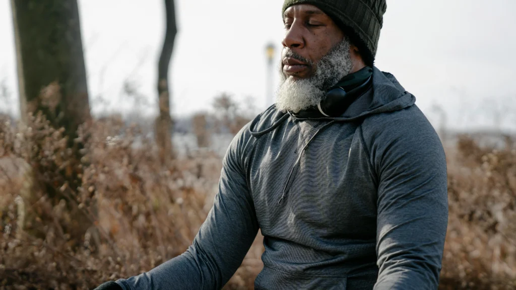 Man meditating in autumn nature to improve memory and concentration