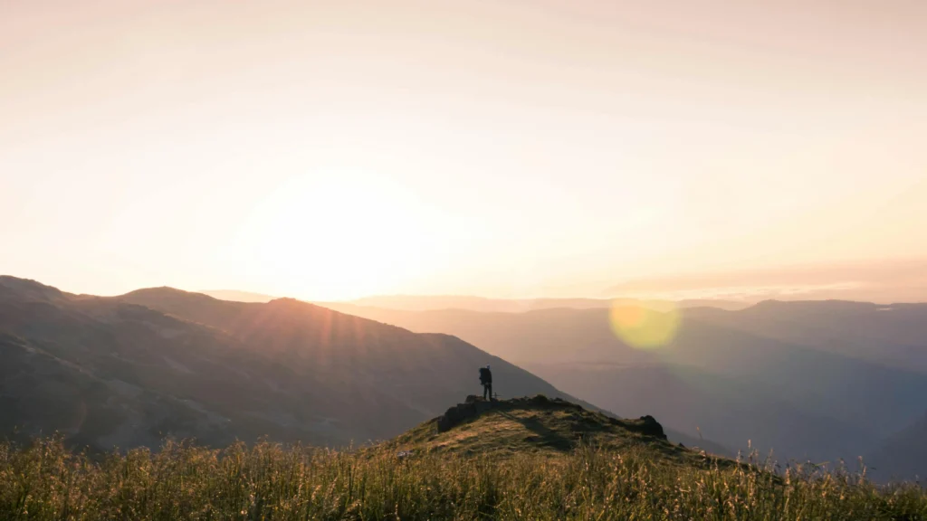 Traveler on hilltop demonstrating how to increase focus and attention span.