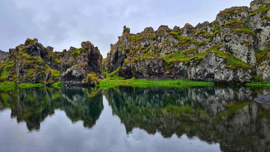 Rocky hills with moss near calm lake to improve mental clarity and focus