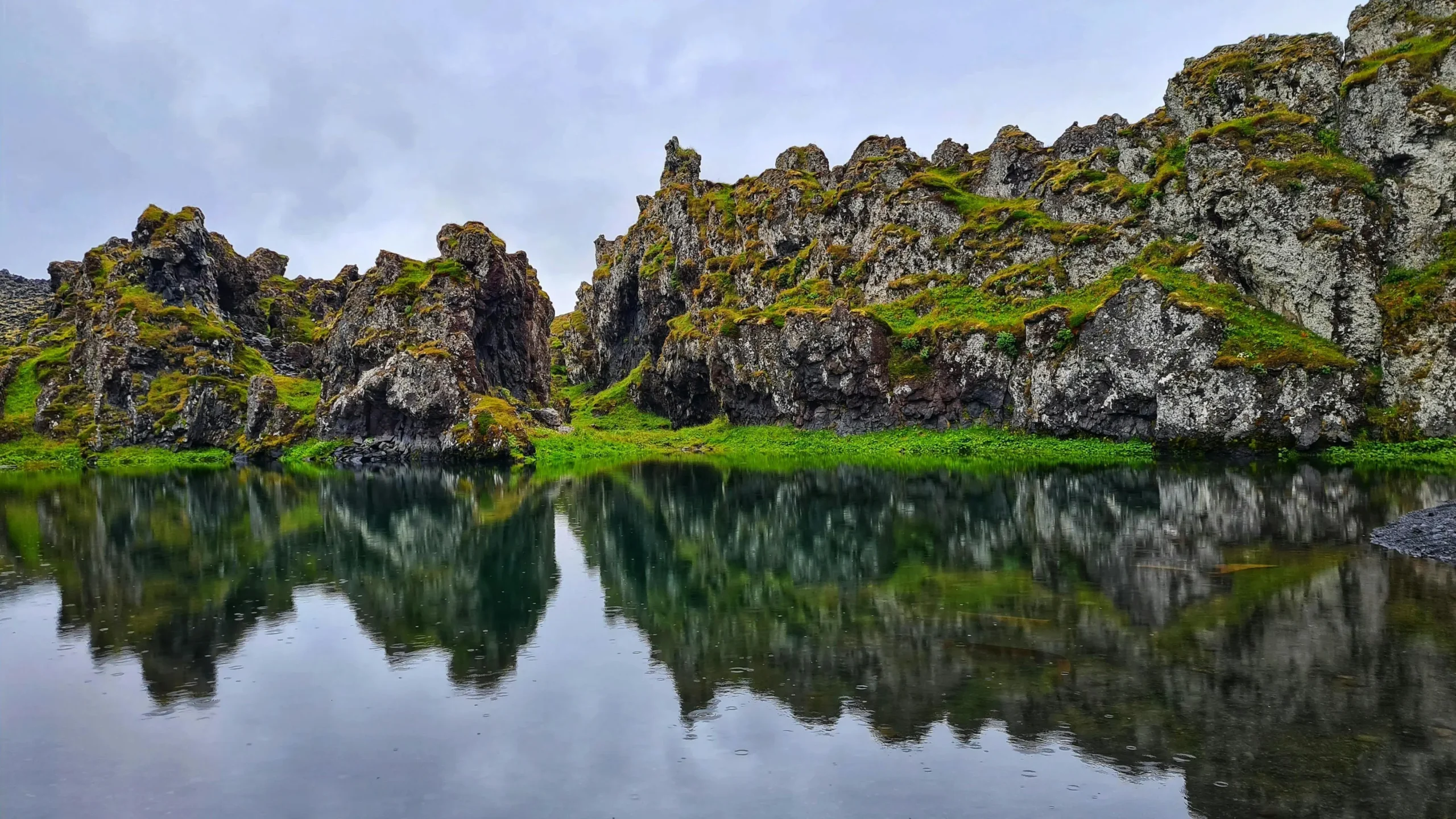 Rocky hills with moss near calm lake to improve mental clarity and focus