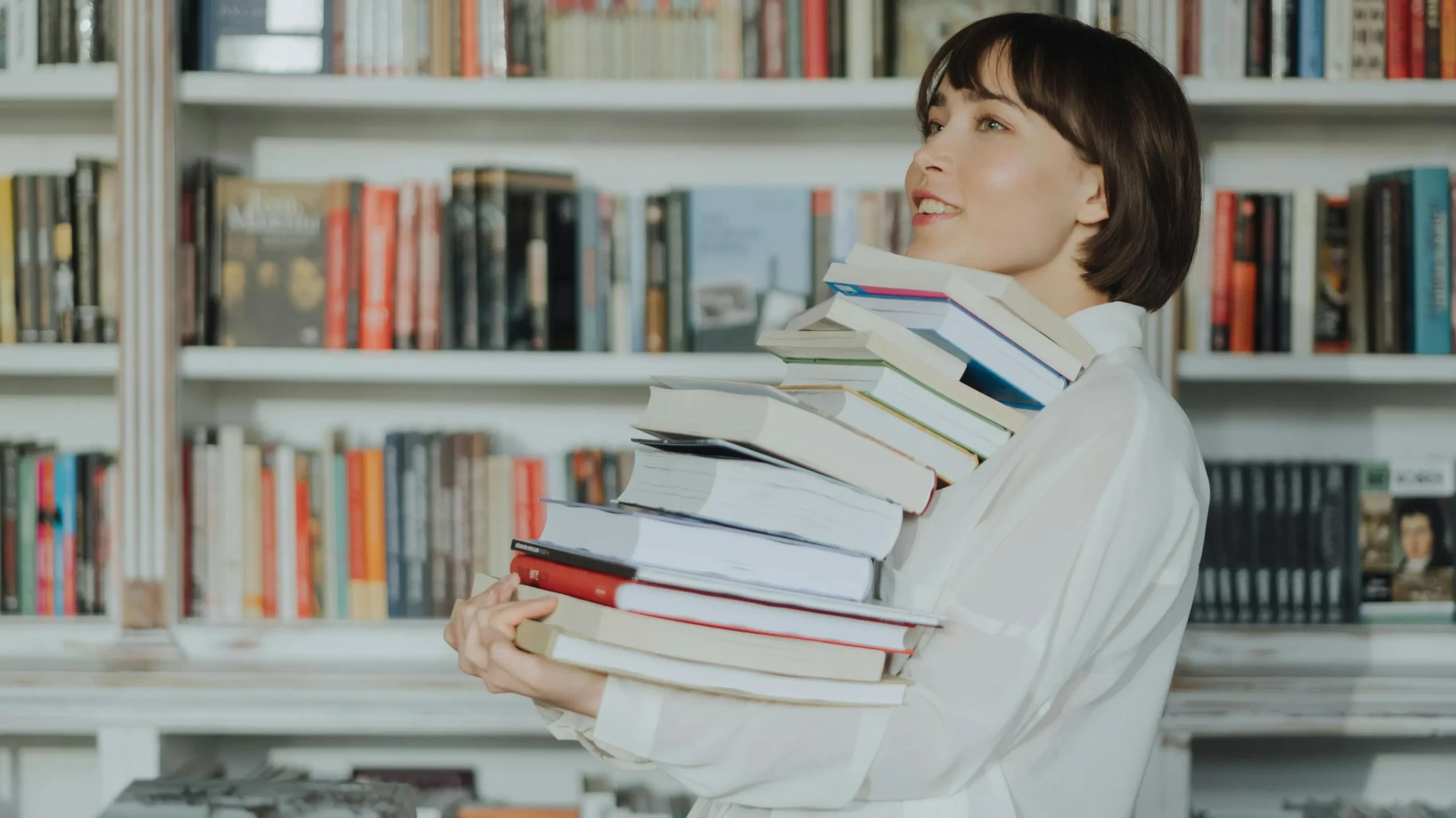 Woman reading a book, experiencing productivity shame