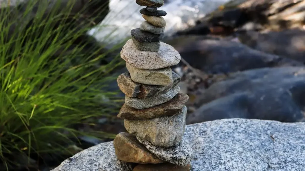 Stack of rocks by a river symbolizing dopamine balance medication