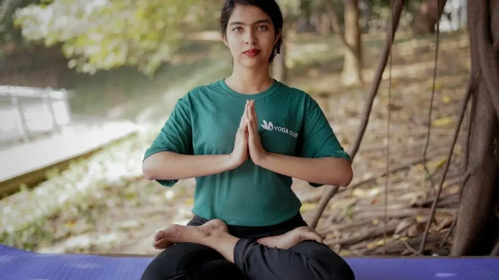 Woman meditating in nature practicing dopamine fast