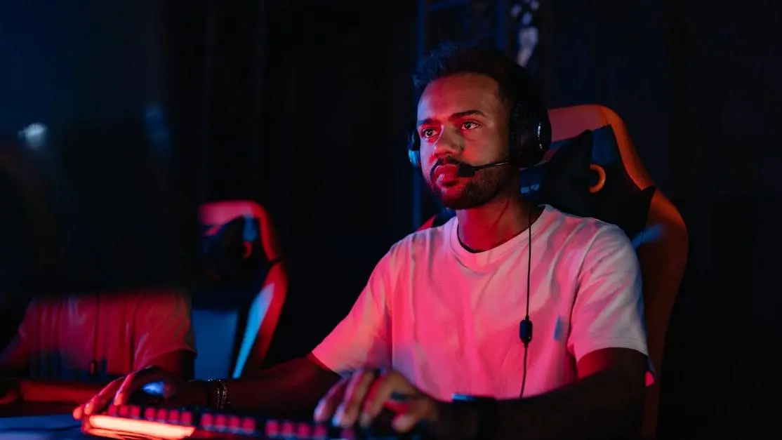 Man in white shirt playing a concentration-boosting computer game