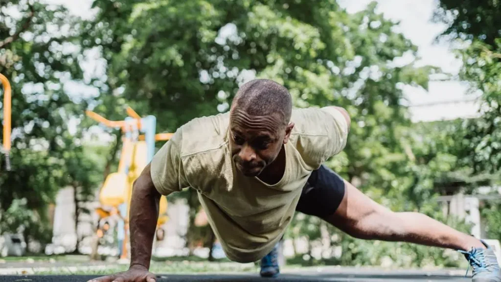 Man Performing One-Arm Push Ups, Good Calisthenic Exercises