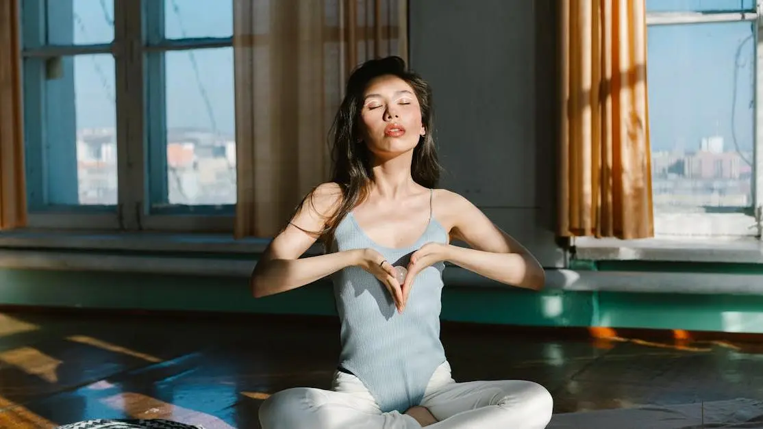 Asian woman meditating with stones for nootropics and anxiety relief