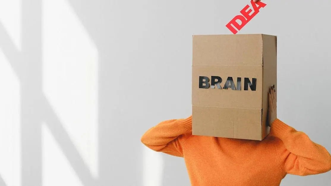 Woman with a box labeled "Brain" on her head, promoting nootropics cognitive enhancers.