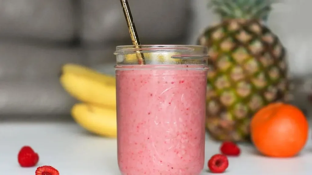 Mason jar with whey protein or whey isolate shake and straw